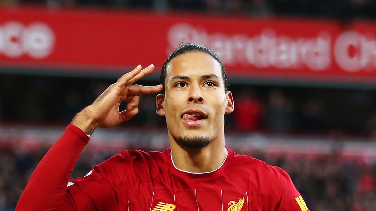 Virgil van Dijk celebrates scoring against Brighton