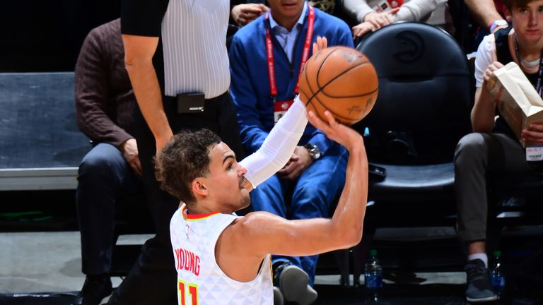 Trae Young shoots a three-pointer in the Hawks' loss to the Raptors