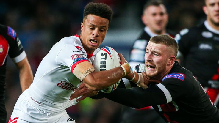 Picture by Alex Whitehead/SWpix.com - 12/10/2019 - Rugby League - Betfred Super League Grand Final - St Helens v Salford Red Devils - Old Trafford, Manchester, England - St Helens' Regan Grace is tackled by Salford's Jackson Hastings.