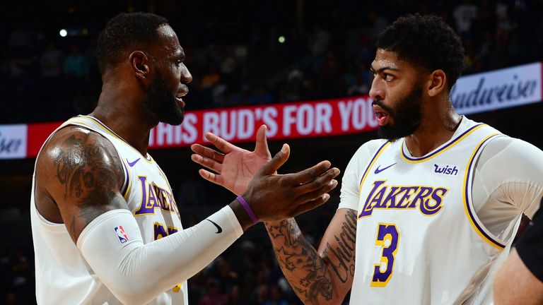 LeBron James and Anthony Davis celebrate the Lakers' win over the Nuggets