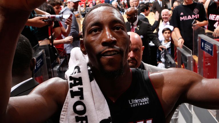 Bam Adebayo high-fives fans after a Heat victory