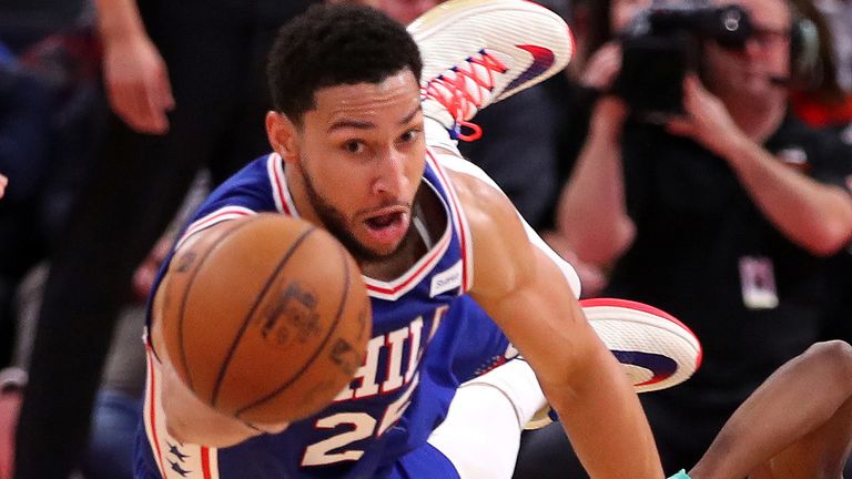 Ben Simmons dives for a loose ball against Detroit