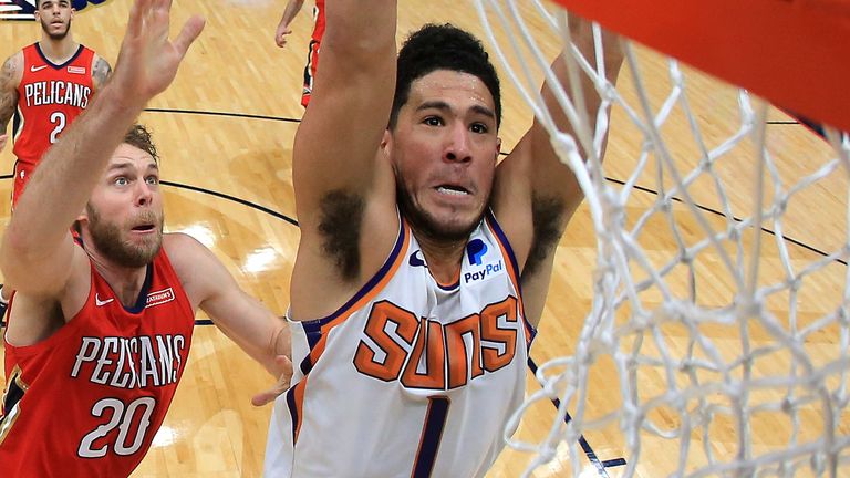 Devin Booker dunks en route to 44 points in the Phoenix Suns' overtime win over the New Orleans Pelicans