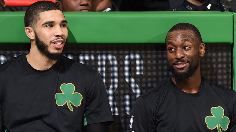Jayson Tatum and Kemba Walker wait to enter the game