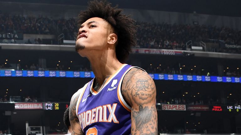 Kelly Oubre flexes after throwing down a muscular dunk against the LA Clippers