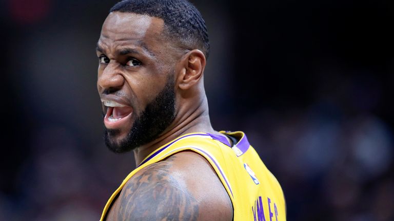 LeBron James encourages his team-mates during the Lakers' loss to the Pacers