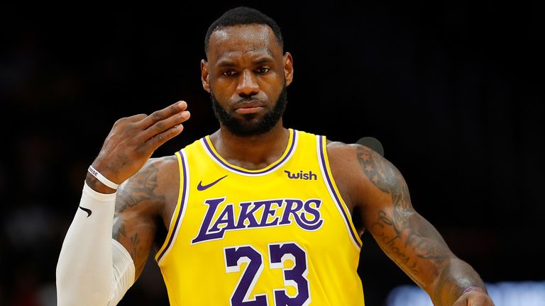 LeBron James celebrates a three-pointer in the Lakers' road win over the Hawks