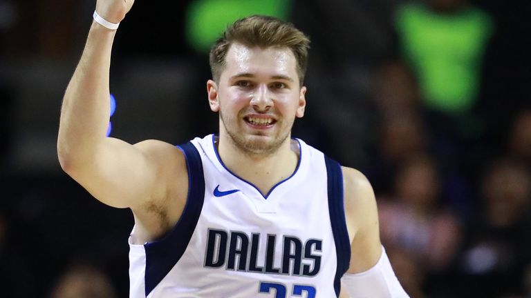 Luka Doncic salutes the crowd after scoring against Detroit in Mexico City