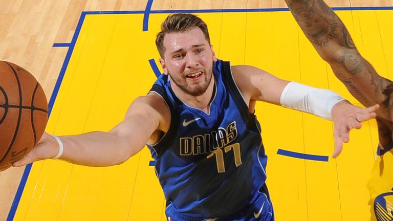 Luka Doncic attacks the basket against Golden State