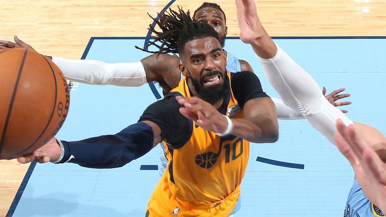 Mike Conley attacks the basket against his former team the Memphis Grizzlies