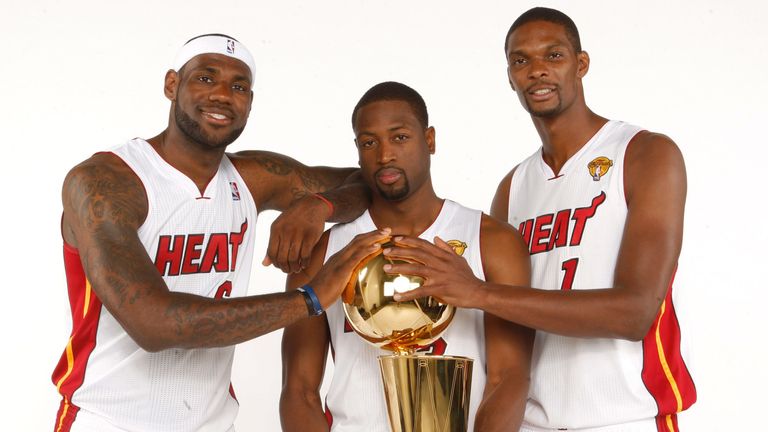 James, Wade and Bosh pictured with the Larry O'Brien trophy