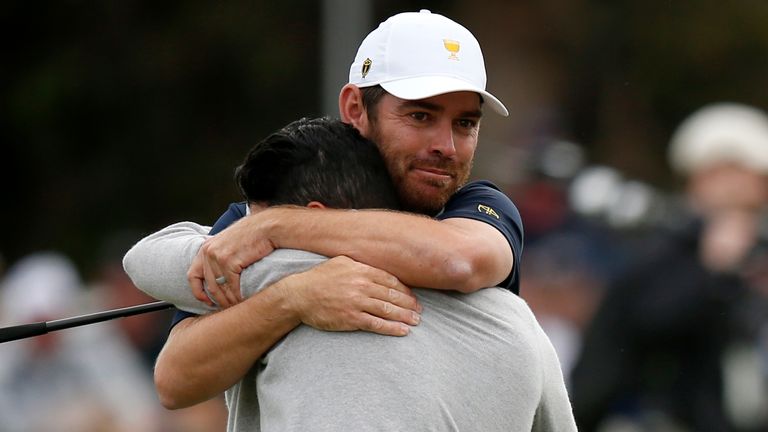 Abraham Ancer of Mexico and the International team and Louis Oosthuizen of South Africa and the International team celebrate during Saturday afternoon foursomes matches on day three of the 2019 Presidents Cup at Royal Melbourne Golf Course 