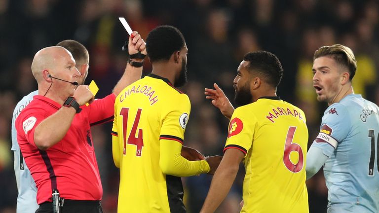 Adrian Mariappa is shown a red card by referee Simon Hooper