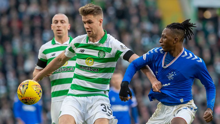 Celtic's Kristoffer Ajer (left) battles with Rangers' Joe Aribo 