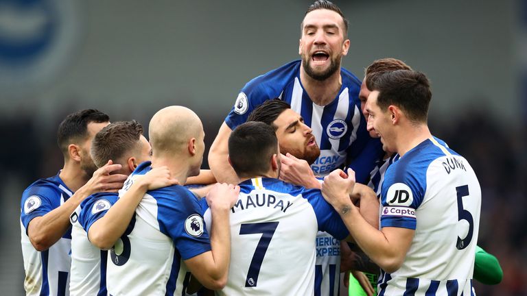 Alireza Jahanbakhsh is mobbed by team-mates after giving Brighton an early lead at home to Bournemouth