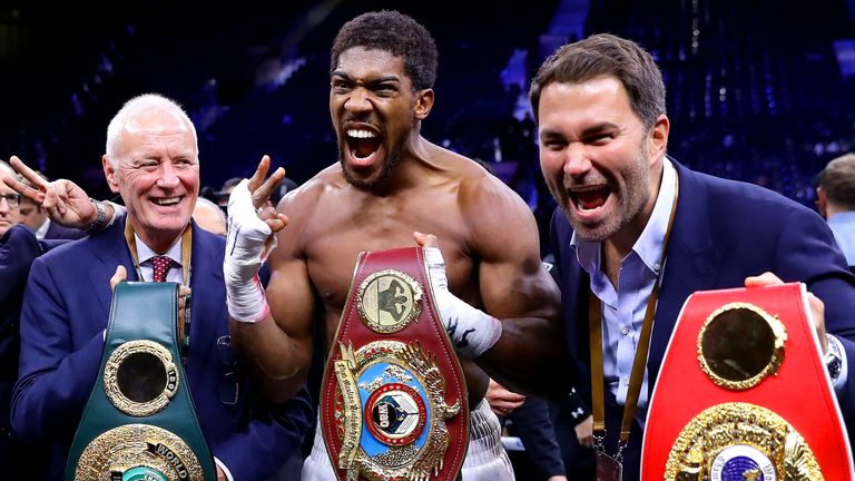 DIRIYAH, SAUDI ARABIA - DECEMBER 07: Anthony Joshua poses for a photo with the IBF, WBA, WBO & IBO World Heavyweight Title belts with Eddie Hearn and Barry Hearn after the IBF, WBA, WBO & IBO World Heavyweight Title Fight between Andy Ruiz Jr and Anthony Joshua during the Matchroom Boxing 'Clash on the Dunes' show at the Diriyah Season on December 07, 2019 in Diriyah, Saudi Arabia (Photo by Richard Heathcote/Getty Images)