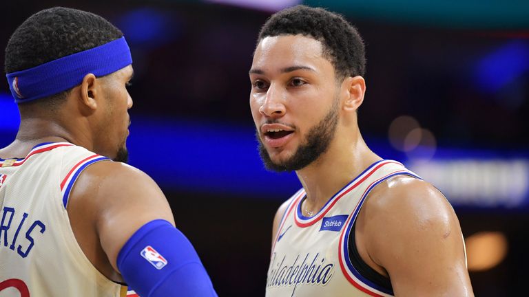 Ben Simmons of the Philadelphia 76ers talks with teammate Tobias Harris against the Cleveland Cavaliers