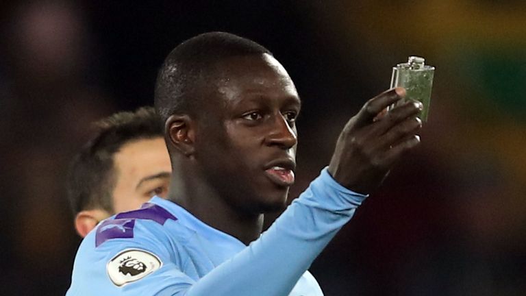 Mendy holds the flask that was thrown onto the Molinuex pitch