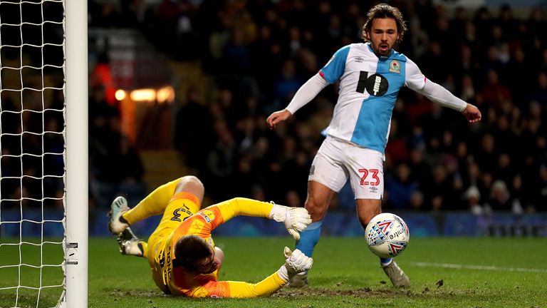 Bradley Dack is denied by Wigan goalkeeper Jamie Jones 