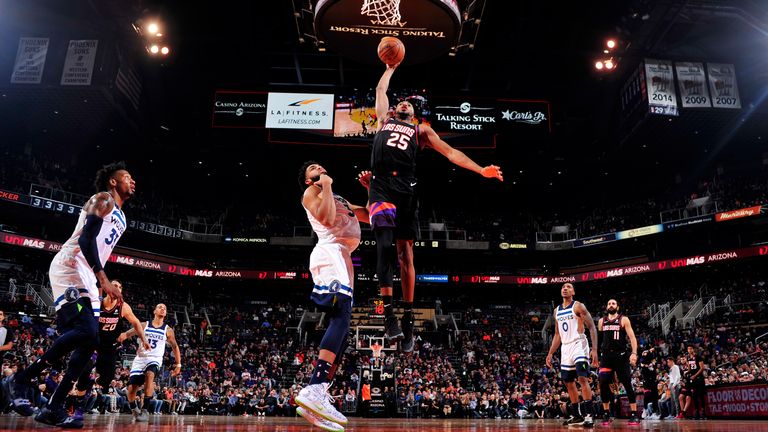 Mikal Bridges of the Phoenix Suns dunks the ball against the Minnesota Timberwolves