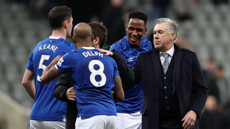 Carlo Ancelotti, Manager of Everton celebrates with Fabian Delph, Michael Keane and Yerry Mina of Everton following their victory in the Premier League match between Newcastle United and Everton FC at St. James Park on December 28, 2019 in Newcastle upon Tyne, United Kingdom.
