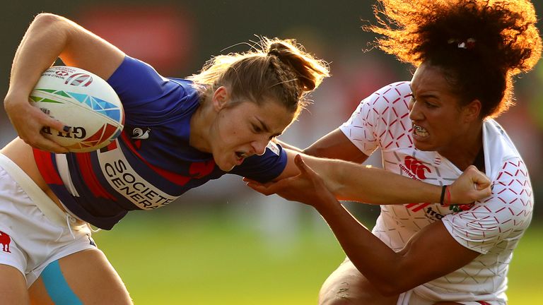 DUBAI, UNITED ARAB EMIRATES - DECEMBER 05: Joanna Grisez of France is tackled by Celia Ounssah of England during the match between England and France on Day One of the HSBC World Rugby Sevens Series - Dubai at The Sevens Stadium on December 05, 2019 in Dubai, United Arab Emirates. (Photo by Francois Nel/Getty Images)