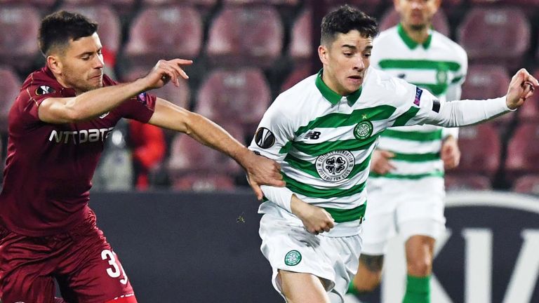 Celtic's Mikey Johnston battles with Cluj's Mihai Catalin Bordeianu