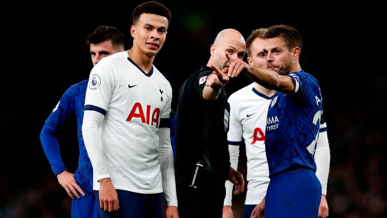 Chelsea's Cesar Azpilicueta points to where alleged racial abuse was coming from during the game against Tottenham
