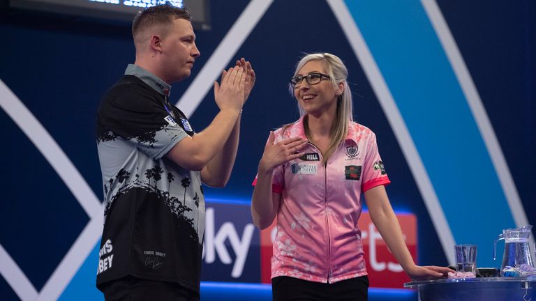 WILLIAM HILL PDC WORLD CHAMPIONSHIP  2020.ALEXANDRA PALACE.LONDON.PIC;LAWRENCE LUSTIG.ROUND 3.FALLON SHERROCK V CHRIS DOBEY.CHRIS DOBEY LEADS THE APPLAUSE FOR FALLON SHERROCK AT THE END.