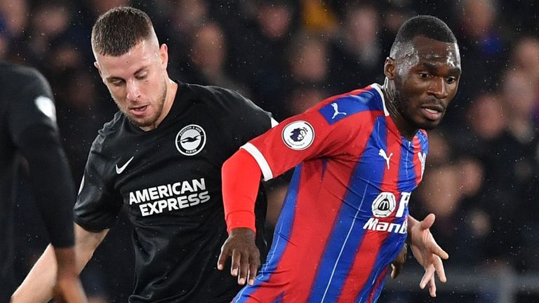 Crystal Palace striker Christian Benteke vies with Brighton defender Adam Webster 