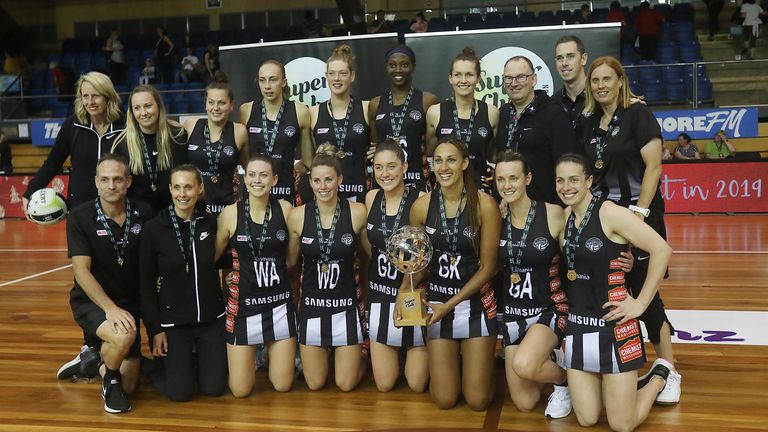 Collingwood Magpies celebrating with their Super Club 2019 trophy