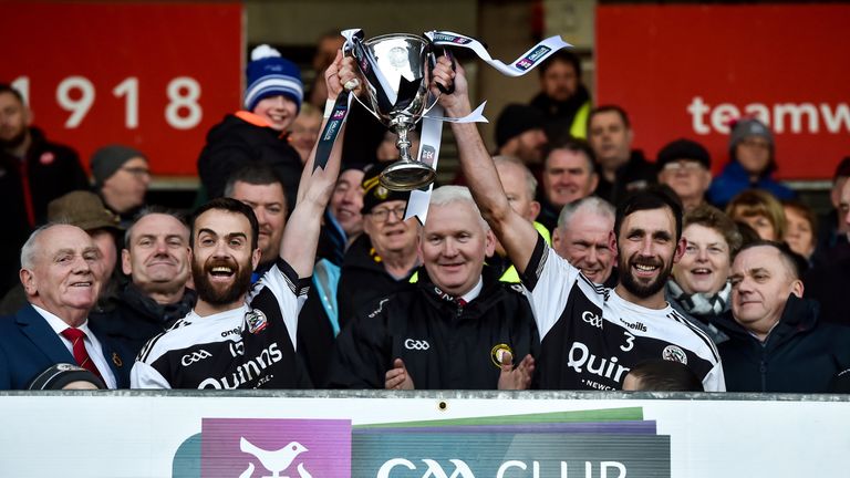 Conor Lavery and Aidan Brannigan of Kilcoo holds aloft the Seamus McFerran Cup