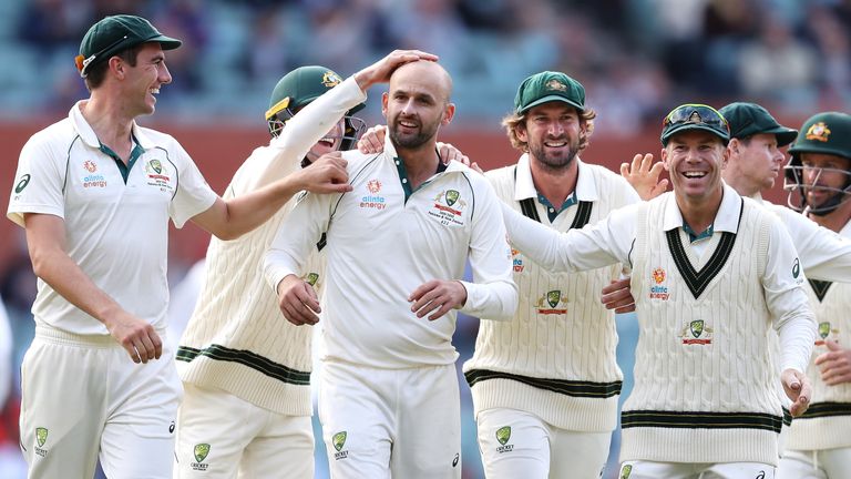 Nathan Lyon (C) celebrates with his Australia team-mates after taking a Pakistan wicket in the second Test at Adelaide