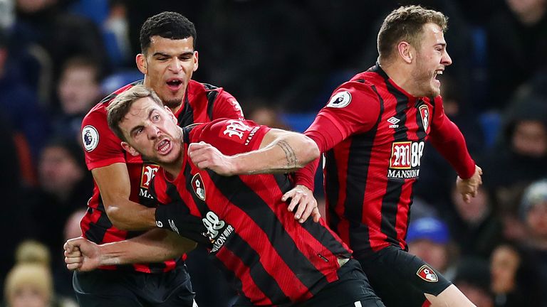 Dan Gosling celebrates with team-mates Dominic Solanke and Ryan Fraser as Bournemouth take the lead at Stamford Bridge