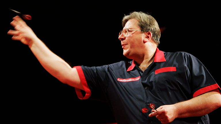 Whitcombe in action against Roland Scholten during the World Darts Championship in 2005