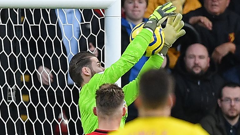 Manchester United's Spanish goalkeeper David de Gea fumbles a shot from Watford's Senegalese midfielder Ismaila Sarr into his own net during the English Premier League football match between Watford and Manchester United at Vicarage Road Stadium in Watford, north of London on December 22, 2019