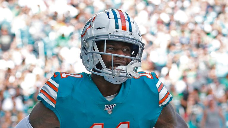 MIAMI GARDENS, FL - DECEMBER 1: DeVante Parker #11 of the Miami Dolphins celebrates after scoring a touchdown against the Philadelphia Eagles during an NFL game on December 1, 2019 at Hard Rock Stadium in Miami Gardens, Florida. The Dolphins defeated the Eagles 37-31. (Photo by Joel Auerbach/Getty Images) *** Local Caption *** DeVante Parker