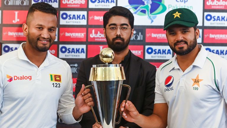 Sri Lanka captain Dimuth Karunaratne and Pakistan captain Azhar Ali pose with the trophy ahead of the first Test series in Pakistan since 2009
