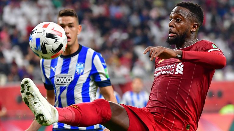 Liverpool's Belgium striker Divock Origi (R) controls the ball as he is marked by Monterrey's defender Cesar Montes during the 2019 FIFA Club World Cup semi-final football match between Mexico's Monterrey and England's Liverpool at the Khalifa International Stadium in the Qatari capital Doha on December 18, 2019. (Photo by Giuseppe CACACE / AFP) (Photo by GIUSEPPE CACACE/AFP via Getty Images)