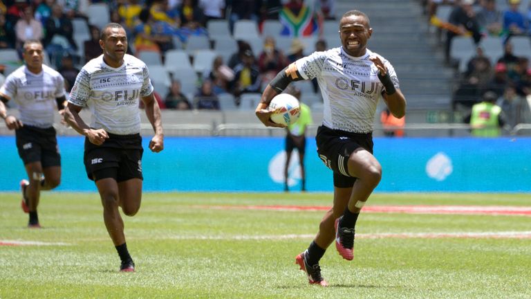 Fiji's Waisea Nacuqu(R) runs with the ball during the HSBC World Rugby Sevens Series men's quarter final rugby match between Fiji and Ireland at the Cape Town Stadium in Cape Town, on December 15, 2019. (Photo by RODGER BOSCH / AFP) (Photo by RODGER BOSCH/AFP via Getty Images)