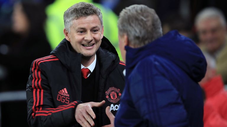 Ole Gunnar Solskjaer greets Cardiff manager Neil Warnock ahead of his first game in charge of Man Utd
