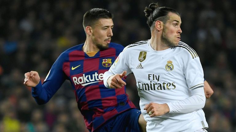 Barcelona's French defender Clement Lenglet (L) challenges Real Madrid's Welsh forward Gareth Bale during the "El Clasico" Spanish League football match between Barcelona FC and Real Madrid CF at the Camp Nou Stadium in Barcelona on December 18, 2019. (Photo by LLUIS GENE / AFP) (Photo by LLUIS GENE/AFP via Getty Images)