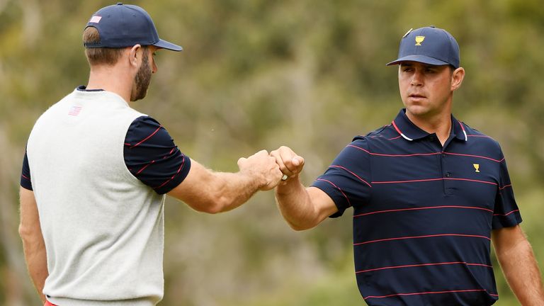 Gary Woodland of the United States team and Dustin Johnson of the United States team celebrate during Saturday afternoon foursomes matches on day three of the 2019 Presidents Cup at Royal Melbourne Golf Course