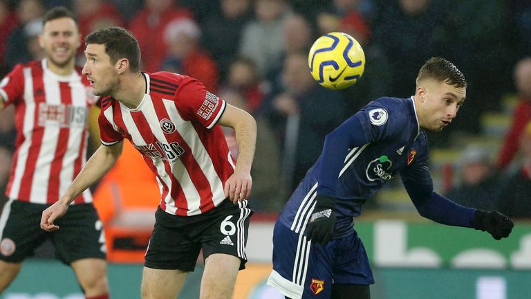 Gerard Deulofeu challenges for the ball with Chris Basham 