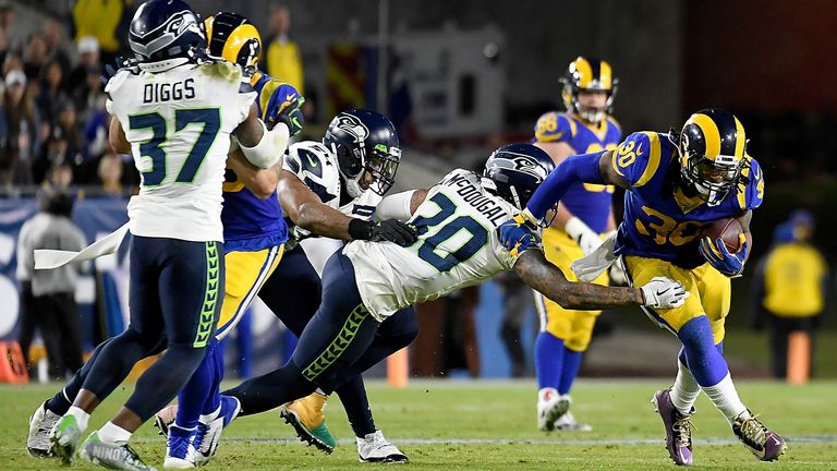 Running back Todd Gurley of the Los Angeles Rams carries the ball against the defence of strong safety Bradley McDougald of the Seattle Seahawks