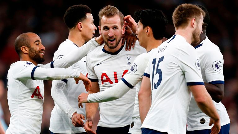 Harry Kane celebrates with team-mates after scoring his second and Spurs' fourth goal