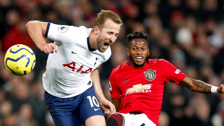 Tottenham Hotspur's Harry Kane (left) and Manchester United's Fred battle for the ball during the Premier League match at Old Trafford, Manchester. PA Photo. Picture date: Wednesday December 4, 2019. See PA story SOCCER Man Utd. Photo credit should read: Martin Rickett/PA Wire. RESTRICTIONS: EDITORIAL USE ONLY No use with unauthorised audio, video, data, fixture lists, club/league logos or "live" services. Online in-match use limited to 120 images, no video emulation. No use in betting, games or single club/league/player publications.