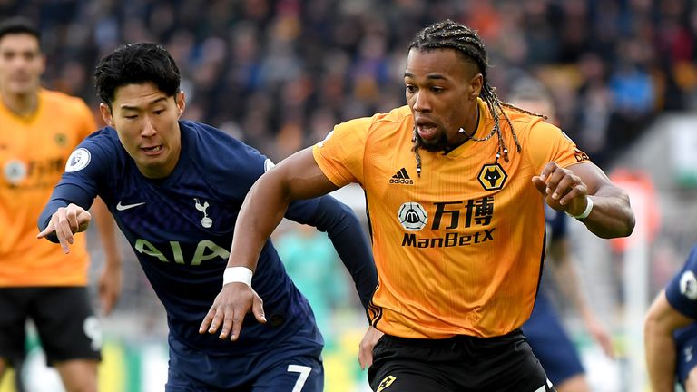 Adama Traore and Heung-Min Son battle for possession 