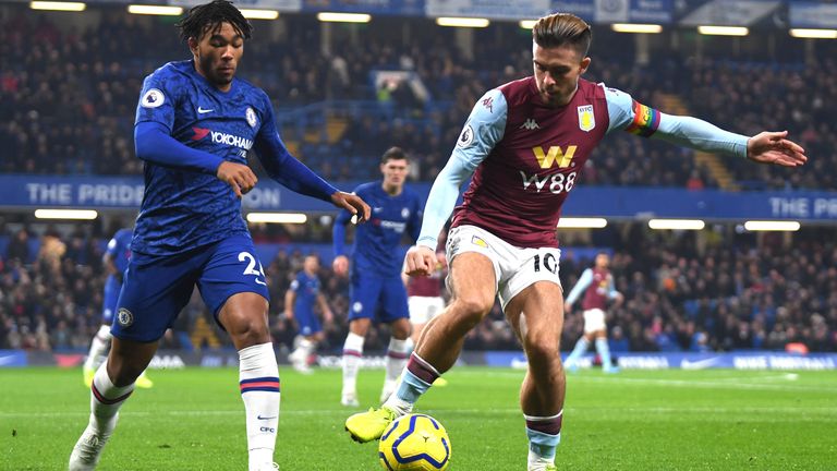 Jack Grealish controls the ball under pressure from Reece James 