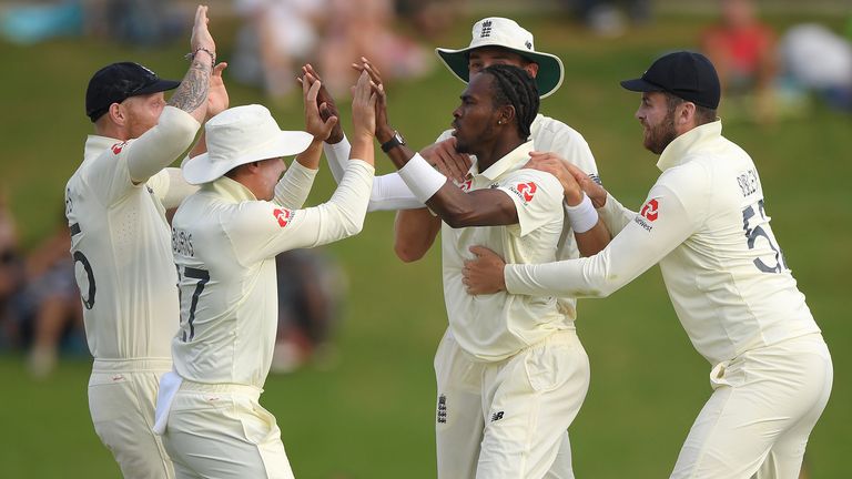 England bowler Jofra Archer celebrates with team mates after taking the wicket of Faf du Plessis (not pictured) during Day Two of the First Test match between England and South Africa at SuperSport Park on December 27, 2019 in Pretoria, South Africa.